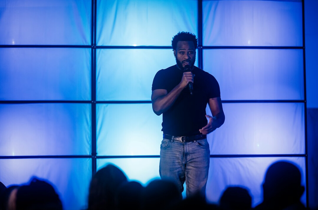 confident speaker on stage
