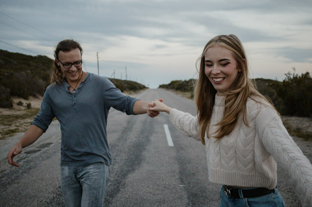 smiling couple holding hands